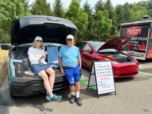 EV owners talk about driving electric at a 2024 Loveland Farmers Market