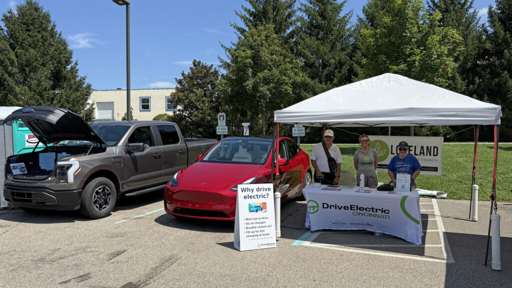 EV owners at a Loveland Farmers Market in 2025